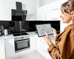 Woman using AI cooking assistant in a smart kitchen